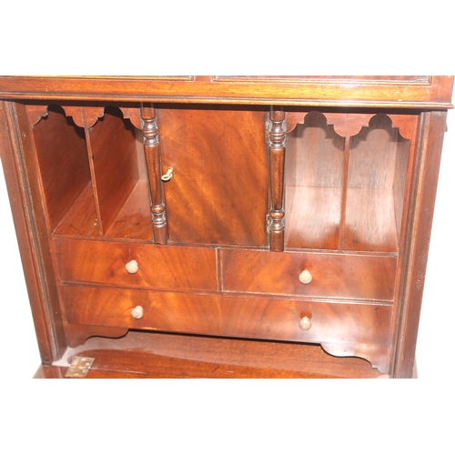 14 - An antique style mahogany fall front bureau or writing desk, approx 63cm wide x 45cm deep x 136cm ta... 