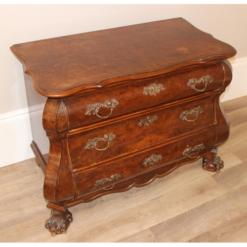 9 - A 19th century Dutch walnut bombe shaped chest, quarter-veneered serpentine top above 3 long convex,... 