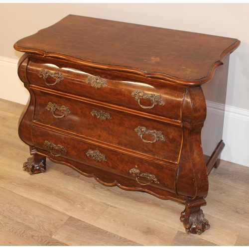 9 - A 19th century Dutch walnut bombe shaped chest, quarter-veneered serpentine top above 3 long convex,... 