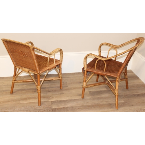 105 - A pair of vintage wicker armchairs, approx 61cm wide x 61cm deep x 68cm tall