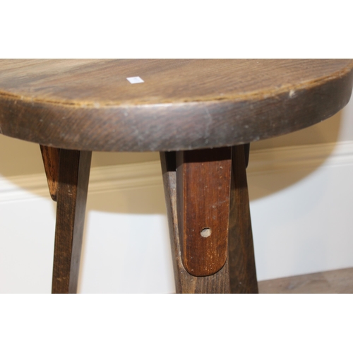 58 - A small vintage circular topped oak side table with 3 legs, approx 46cm wide x 46cm deep x 67cm tall