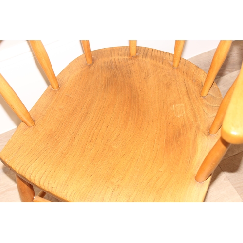 51 - A vintage elm seated smokers bow chair, approx 55cm wide x 55cm deep x 81cm tall