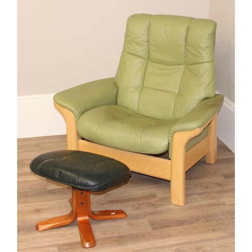 39 - A light green leather Ekornes Stressless armchair and a similar footstool, approx 104cm wide x 81cm ... 