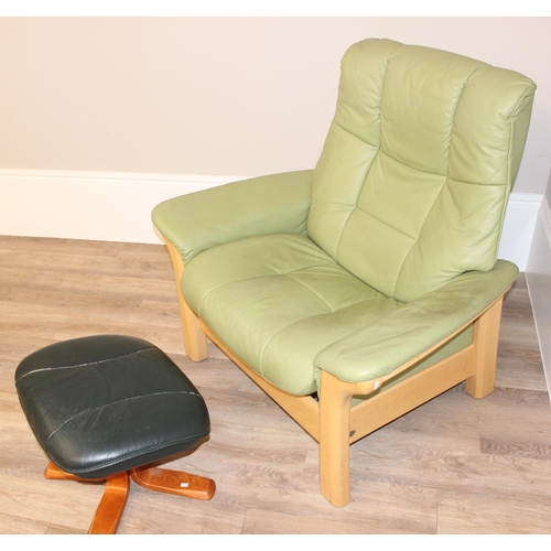 39 - A light green leather Ekornes Stressless armchair and a similar footstool, approx 104cm wide x 81cm ... 