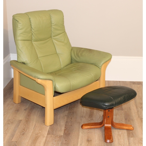 39 - A light green leather Ekornes Stressless armchair and a similar footstool, approx 104cm wide x 81cm ... 