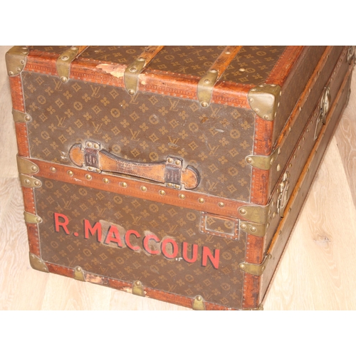 3 - A Louis Vuitton canvas wardrobe trunk, early 20th century, with ash banding, leather edging and deta... 