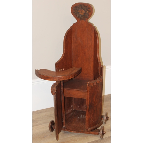 57 - An unusual vintage folk art children's high chair or walker, with wheels and with painted details, e... 