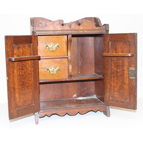 337 - An early 20th century carved oak table top or smoker's cabinet with fitted interior, approx 33cm wid... 