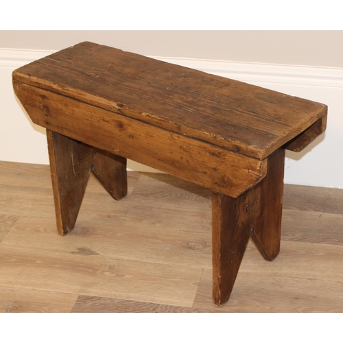 26 - A low rustic pine stool, approx 71cm wide x 26cm deep x 43cm tall