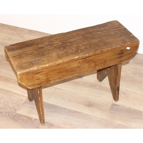 26 - A low rustic pine stool, approx 71cm wide x 26cm deep x 43cm tall