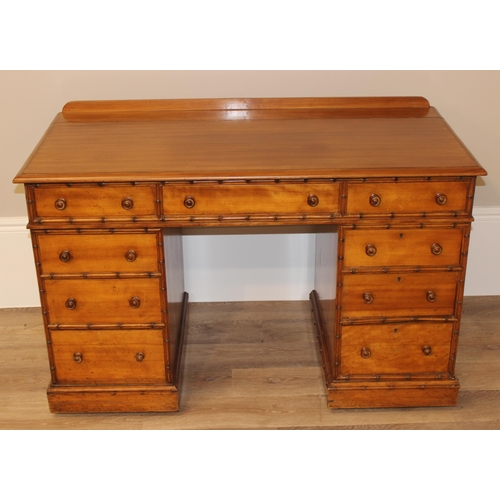 5 - Howard & Sons - a rare 19th century pedestal desk, the moulded rectangular top above a kneehole rece... 