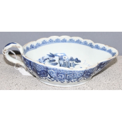 1765 - An antique Chinese blue and white gravy boat of ribbed form, likely 19th century, approx 20cm long