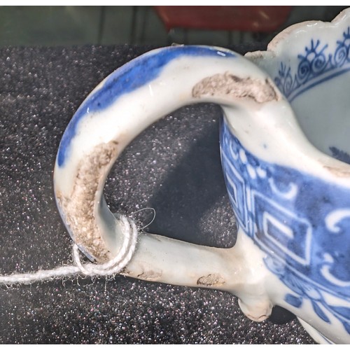 1765 - An antique Chinese blue and white gravy boat of ribbed form, likely 19th century, approx 20cm long