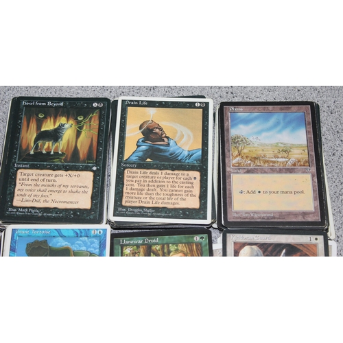 611 - Single owner collection - A box of different coloured Magic the Gathering cards mostly from the 90's... 