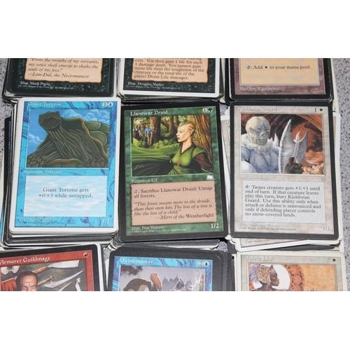 611 - Single owner collection - A box of different coloured Magic the Gathering cards mostly from the 90's... 