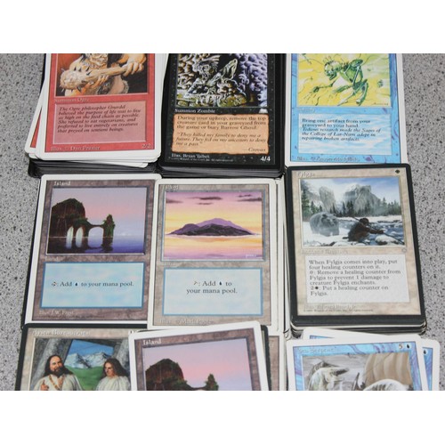 611 - Single owner collection - A box of different coloured Magic the Gathering cards mostly from the 90's... 