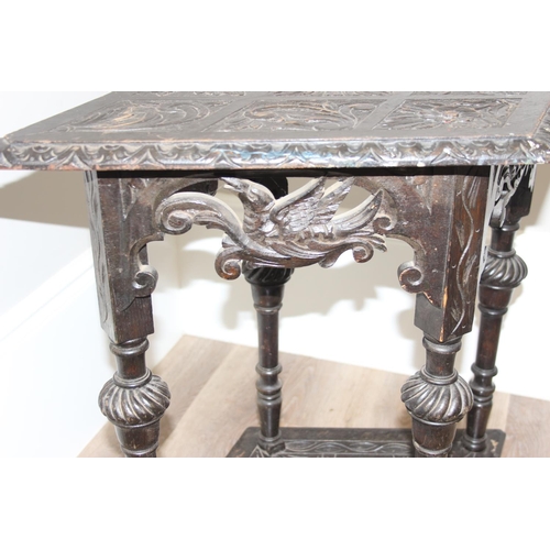 178 - A 17th century style heavily carved dark oak side or hall table with diamond shaped top, approx 80 x... 