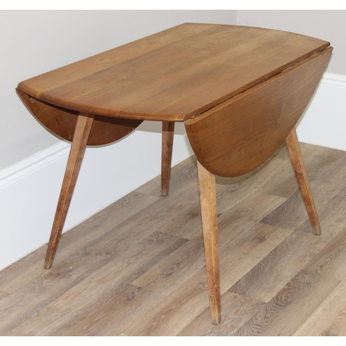 109 - Mid-century oval shaped Ercol drop-leaf kitchen table, with blue & gold Ercol label, approx 113cm W ... 