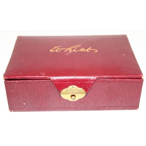 614 - A superb quality early 20th century whist set in red Moroccan leather case, with contents