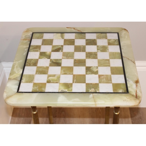 137 - A vintage onyx or marble chess board on gilt metal table base, approx 46cm wide x 46cm deep x 68cm t... 