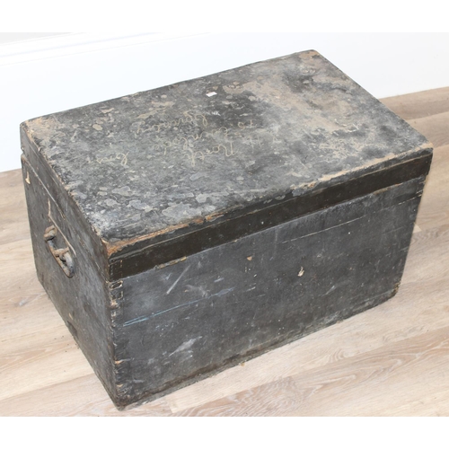 139 - A vintage black painted pine trunk or box with wrought iron handles, approx 70cm wide x 43cm deep x ... 