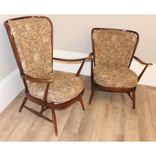 141 - 2 vintage Ercol armchairs with patterned upholstery and stick backs, the larger approx 73cm wide x 8... 