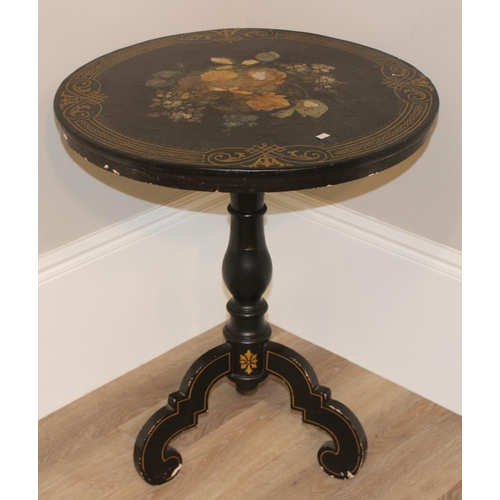 143 - An antique black painted tilt topped table with gilt painted border and central painted flowers with... 