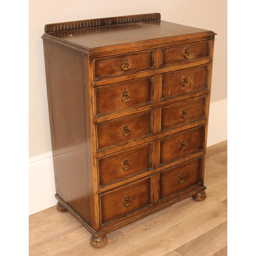 146 - An unusual Queen Anne style oak 5 drawer chest of drawers formed as a set of 10 faux drawers with br... 