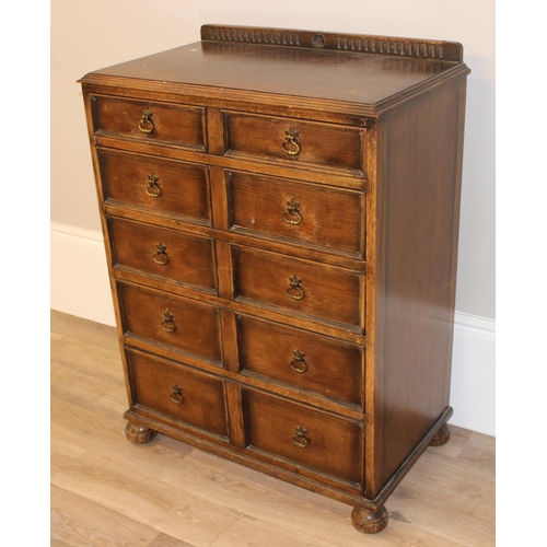 146 - An unusual Queen Anne style oak 5 drawer chest of drawers formed as a set of 10 faux drawers with br... 