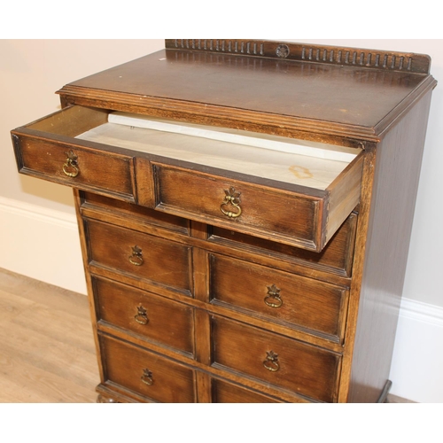 146 - An unusual Queen Anne style oak 5 drawer chest of drawers formed as a set of 10 faux drawers with br... 