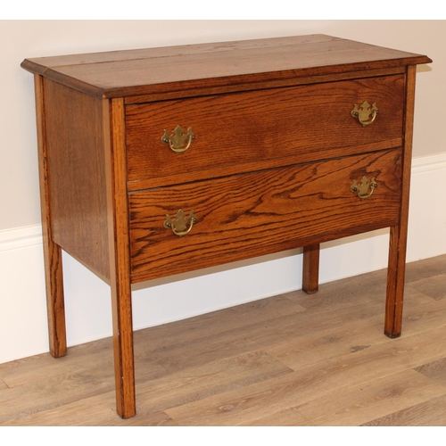 147 - A small vintage oak 2 drawer chest of drawers on square legs, approx 91cm wide x 45cm deep x 78cm ta... 