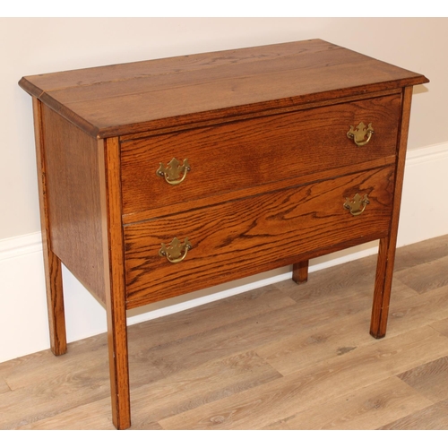 147 - A small vintage oak 2 drawer chest of drawers on square legs, approx 91cm wide x 45cm deep x 78cm ta... 