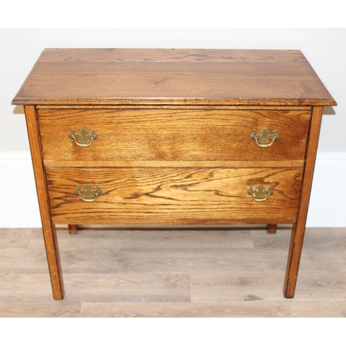 147 - A small vintage oak 2 drawer chest of drawers on square legs, approx 91cm wide x 45cm deep x 78cm ta... 