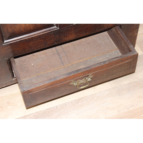 148 - An 18th century oak mule chest with panelled sides and 2 drawers to base, with later oak half foldin... 