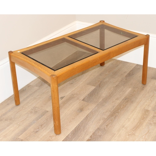 159 - Rectangular Ercol coffee table with dual glass panel top, approx 106cm W x 59cm D x 49cm H