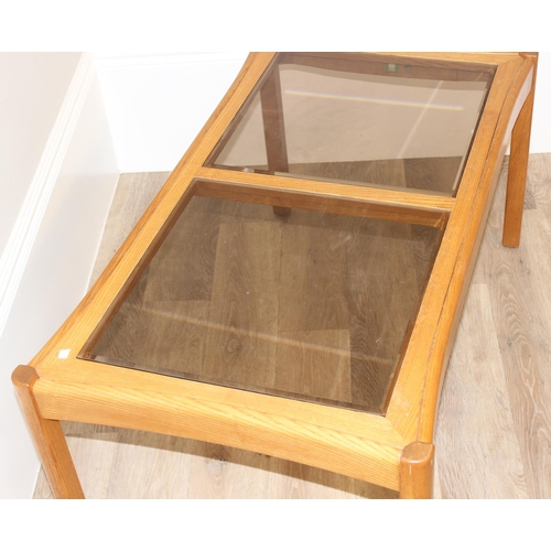 159 - Rectangular Ercol coffee table with dual glass panel top, approx 106cm W x 59cm D x 49cm H