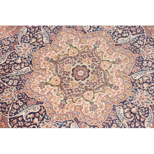 202 - A large vintage Dwalabad decorative rug of red and blue ground, approx 300 x 200cm