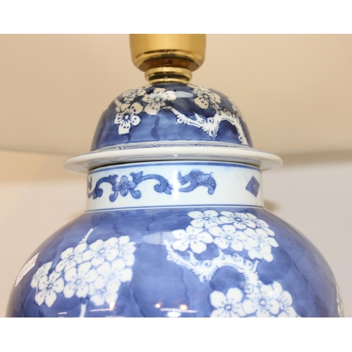 253 - Vintage blue and white Chinese style ginger jar shaped lamp with cherry blossom design decoration on... 