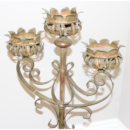 300 - Wrought iron 3 branch freestanding candleholder with leaf design, approx 130cm