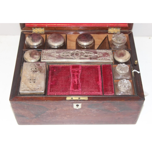 303 - Antique ladies travelling vanity case with silver plate and cut glass jars, red velvet interior appr... 