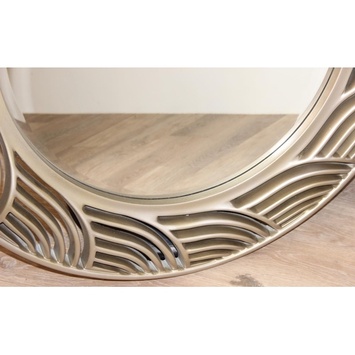 417 - Large round mirror with wave style design frame, approx 97cm diam