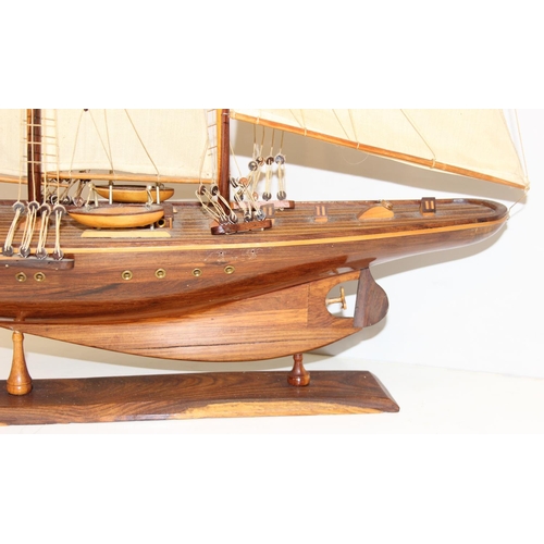 602 - A high quality vintage wooden and canvas scratch-built model of a yacht with 3 masts, approx 83 x 73... 