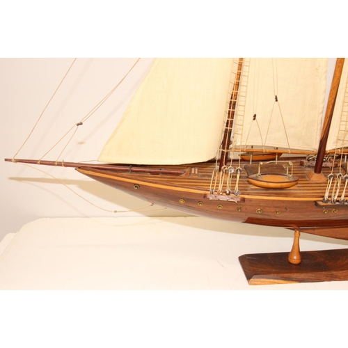 602 - A high quality vintage wooden and canvas scratch-built model of a yacht with 3 masts, approx 83 x 73... 