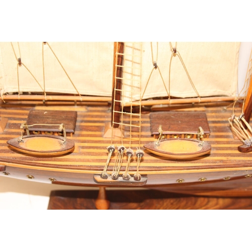 602 - A high quality vintage wooden and canvas scratch-built model of a yacht with 3 masts, approx 83 x 73... 