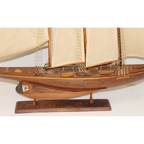 602 - A high quality vintage wooden and canvas scratch-built model of a yacht with 3 masts, approx 83 x 73... 