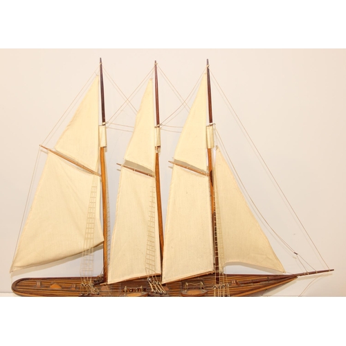 602 - A high quality vintage wooden and canvas scratch-built model of a yacht with 3 masts, approx 83 x 73... 