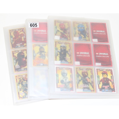 605 - 3 folders containing hundreds of Lego Ninjago trading cards from 2016-2018