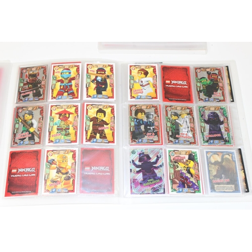 605 - 3 folders containing hundreds of Lego Ninjago trading cards from 2016-2018