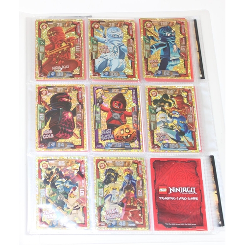 605 - 3 folders containing hundreds of Lego Ninjago trading cards from 2016-2018