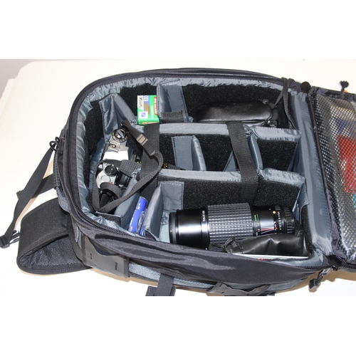 706 - Tamrac Expedition 6x photographers backpack with a large qty of assorted cameras and odds to inc a P... 